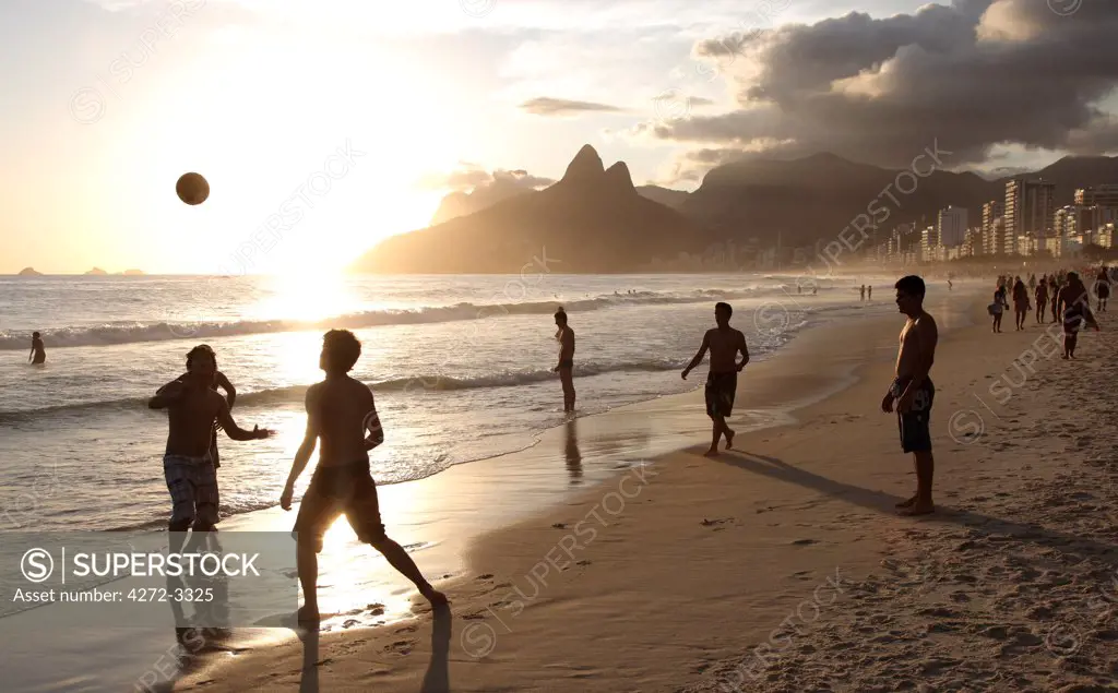 The famous Ipanema Beach in Rio de Janeiro with the Two Brothers Mountain in the background at sunset. Brazil