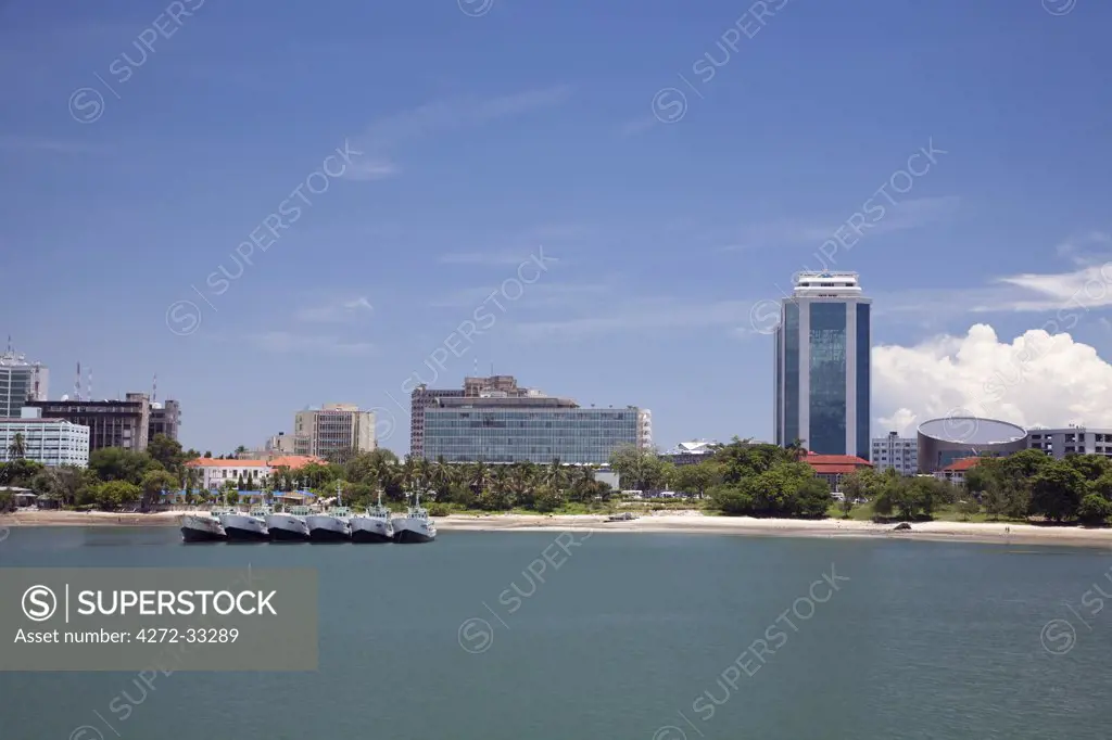 Tanzania, Dar es Salaam. Modern glass skyscrapers stand alongside older buildings on Dar es Salaam's coast.