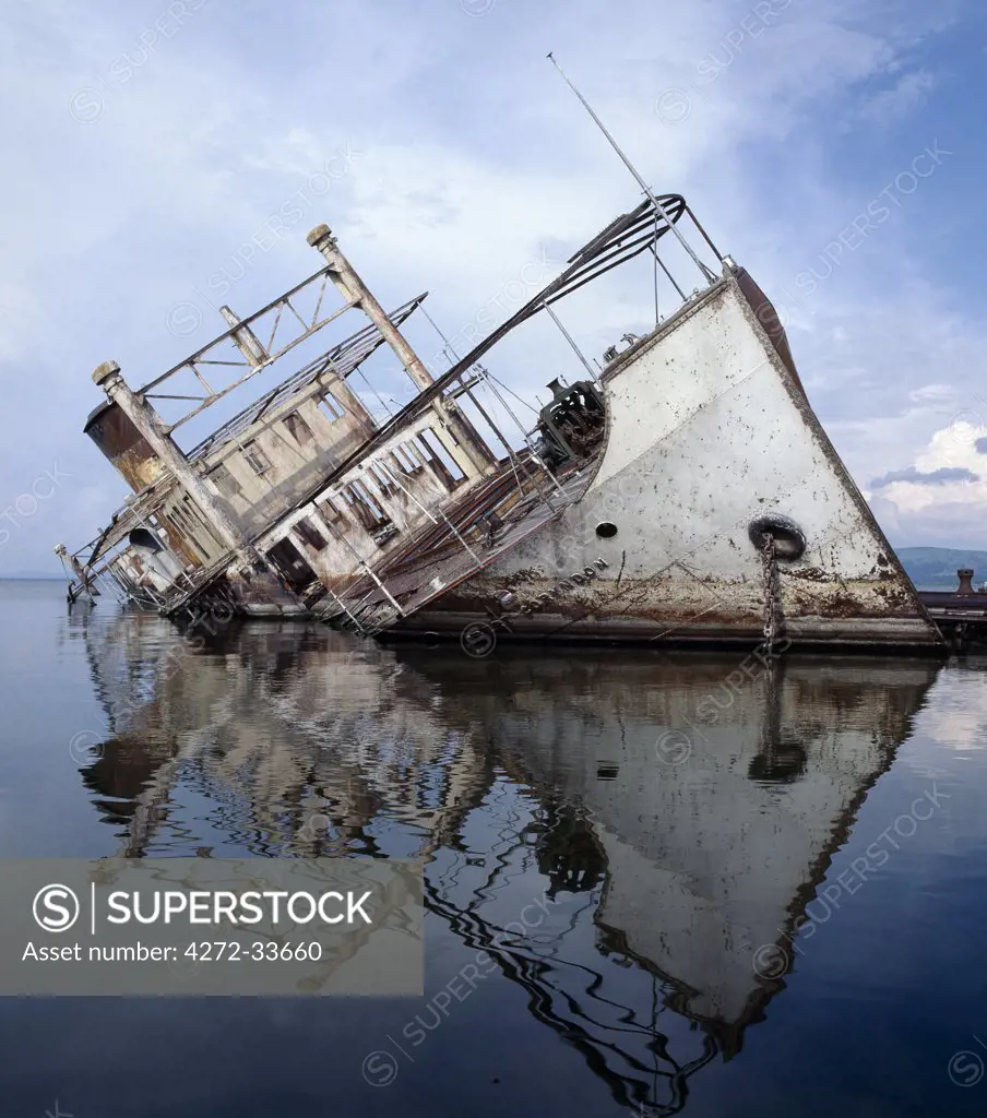 Derelict lake steamer, The Robert Coryndon, lies rusting on its side at Butiaba on the eastern shores of Lake Albert, refusing to submit to the overwhelming forces of nature.  The 850 ton twin screw steamship entered service in 1930, and was regarded as the most luxurious of all passenger boats operating an elegant service to Pakwach on the Nile and to Kasenye in the Congo.