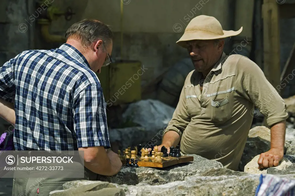 Men Playing Chess on the Street