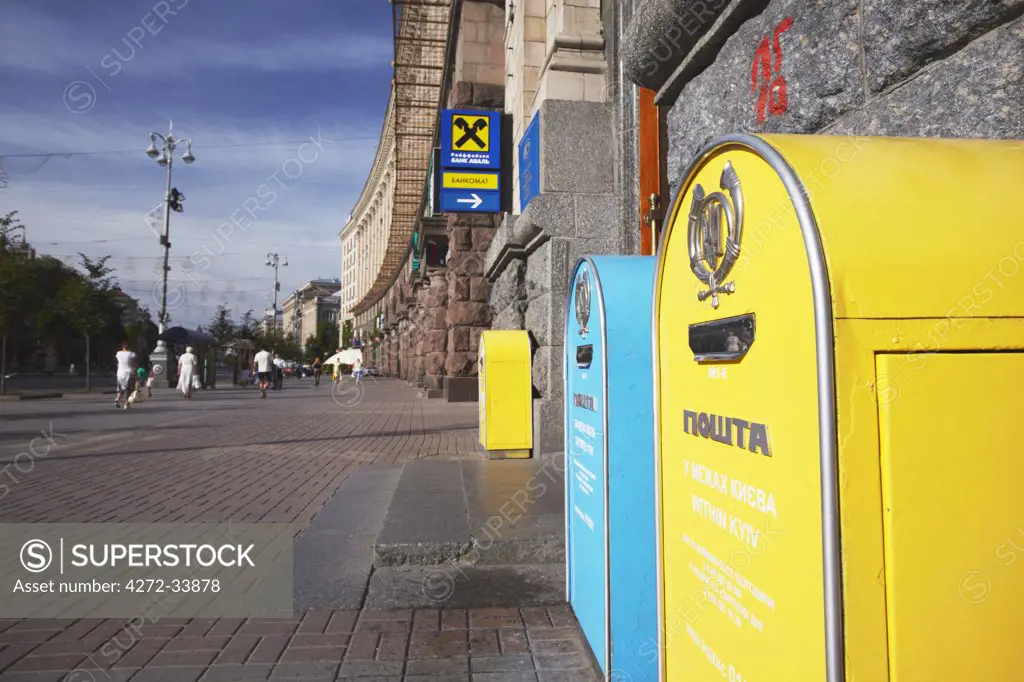 Yellow and blue postboxes outside Central Post Office, Kiev, Ukraine
