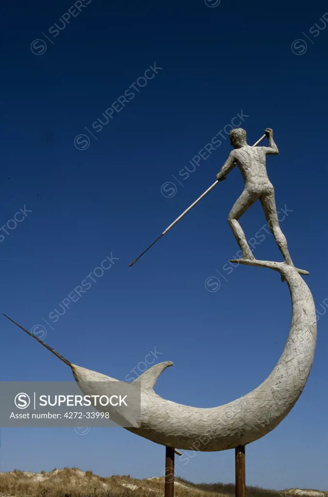 A statue of Narwhal being speared at Menemsha Harbour.