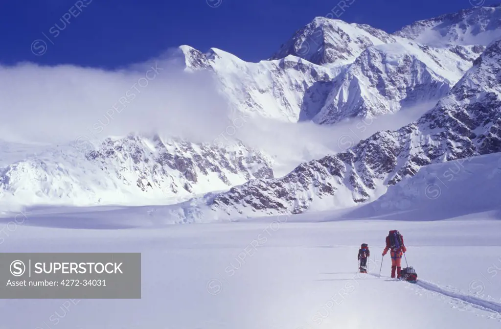 Climbers ski up the Kahiltna Glacier towards Mount McKinley