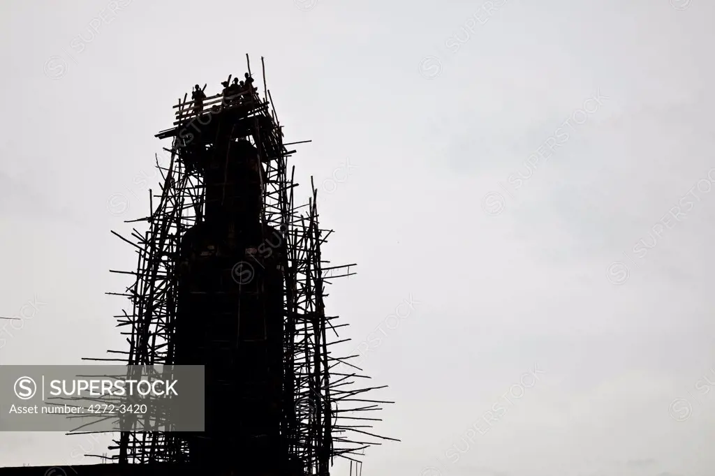 Bujumbura, Burundi. Workers construct the minaret of a new mosque in the city.