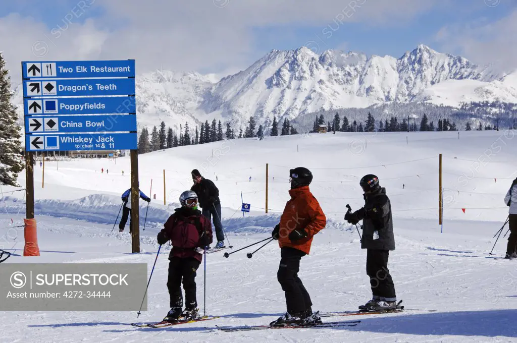 USA, Colorado, Vail Ski Resort. Skiers looking for directions infront of the Gore Mountains
