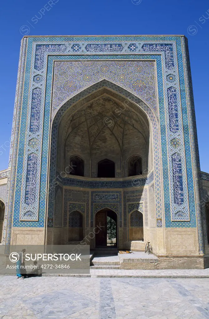 Uzbek men sit outside The Kalan Mosque.  Built in 1121-22AD during the reign of the Kharakhanid ruler Arslan Khan Muhammed.