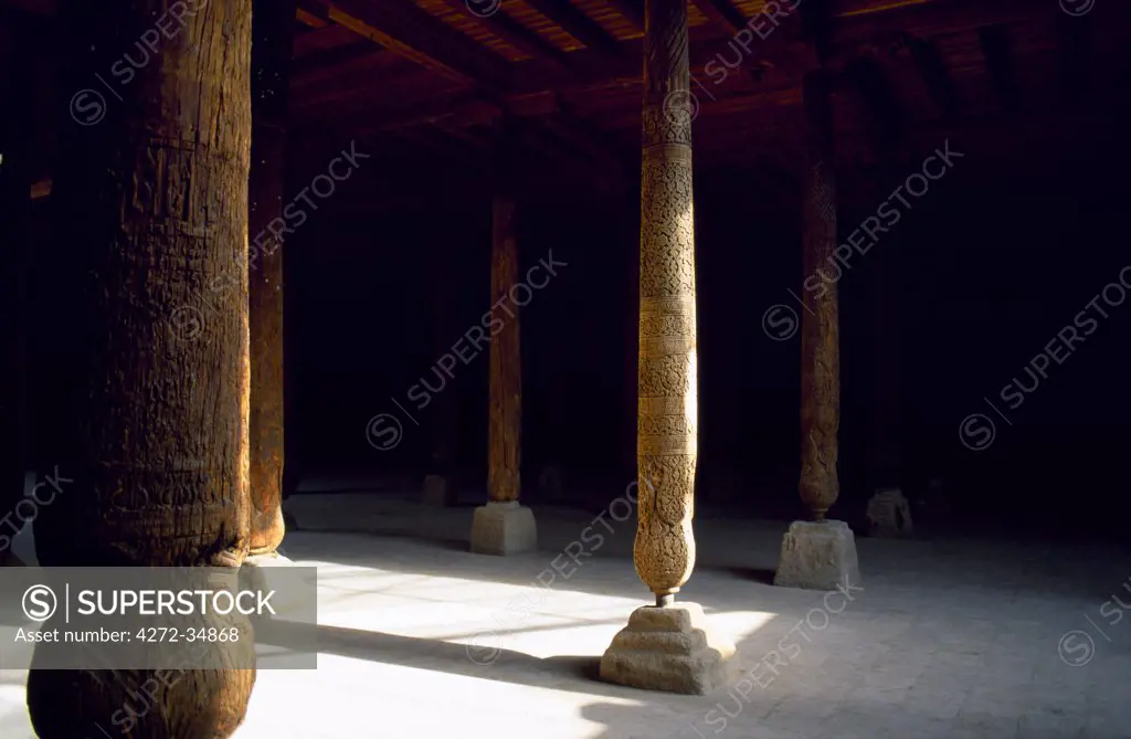 Elaborately carved wooden columns in the main hall of the Jame (Friday) mosque which dates between the 10th to 18th Century