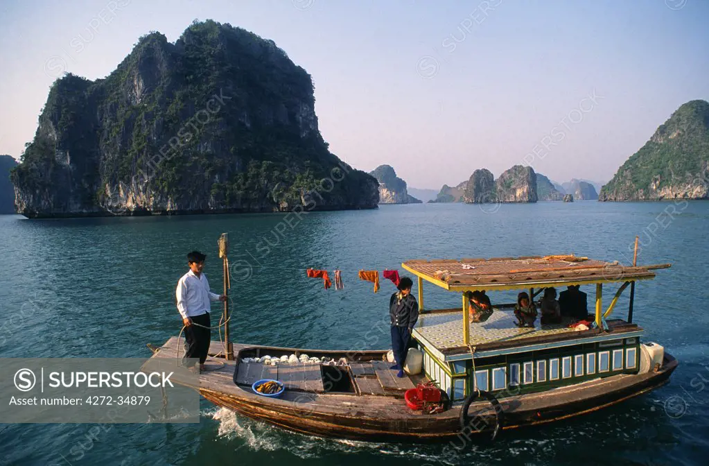 Coral sellers in a boat, Ha Long Bay Ha Long Bay extends over 1500 sq km of the Gulf of Tonkin at the north east corner of Vietnam, with over 3000 islands riddled with Karst Limestone Caves. Ha Long Bay was declared as a world heritage site by UNESCO.