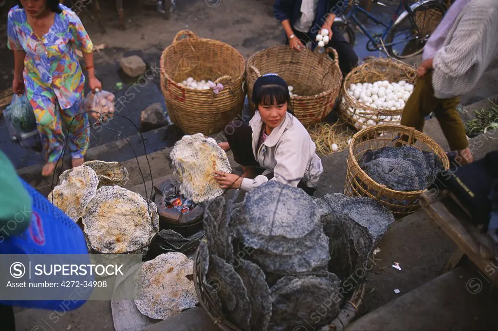 Vendors selling freshly cooked fish crackers in the Central Market