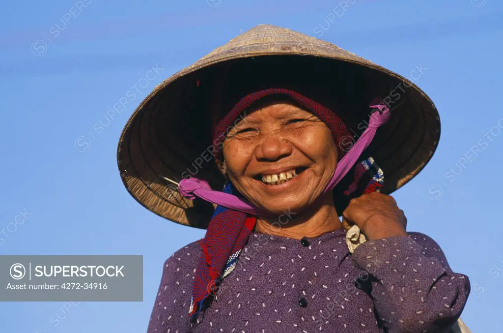 Older Vietnamese woman wearing Asian style conical hat