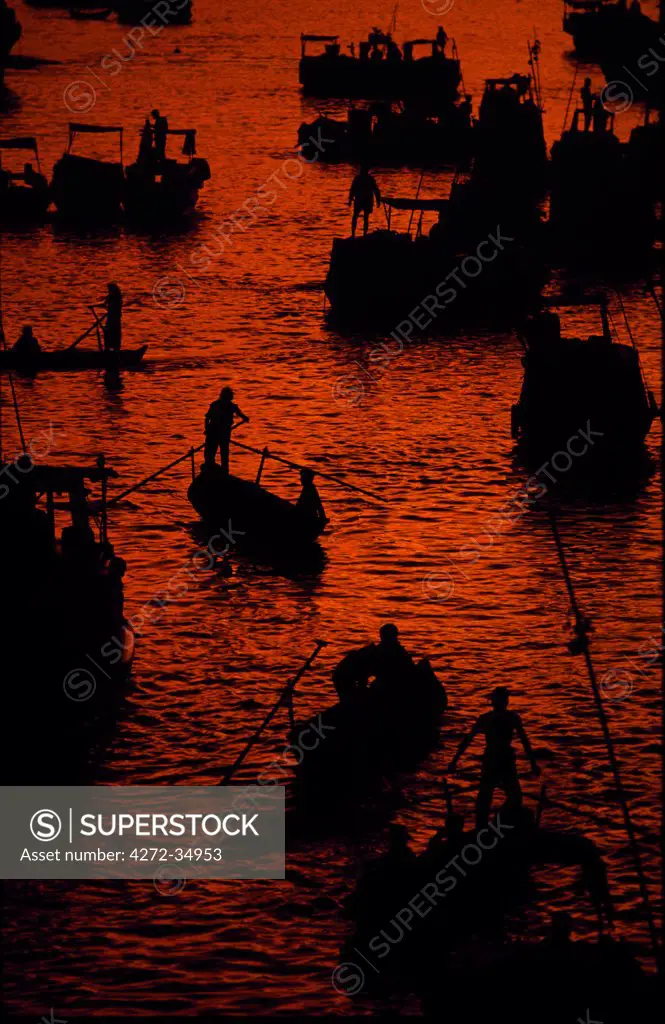 Sunrise at the floating market on the Mekong River, near the town of Cantho.&