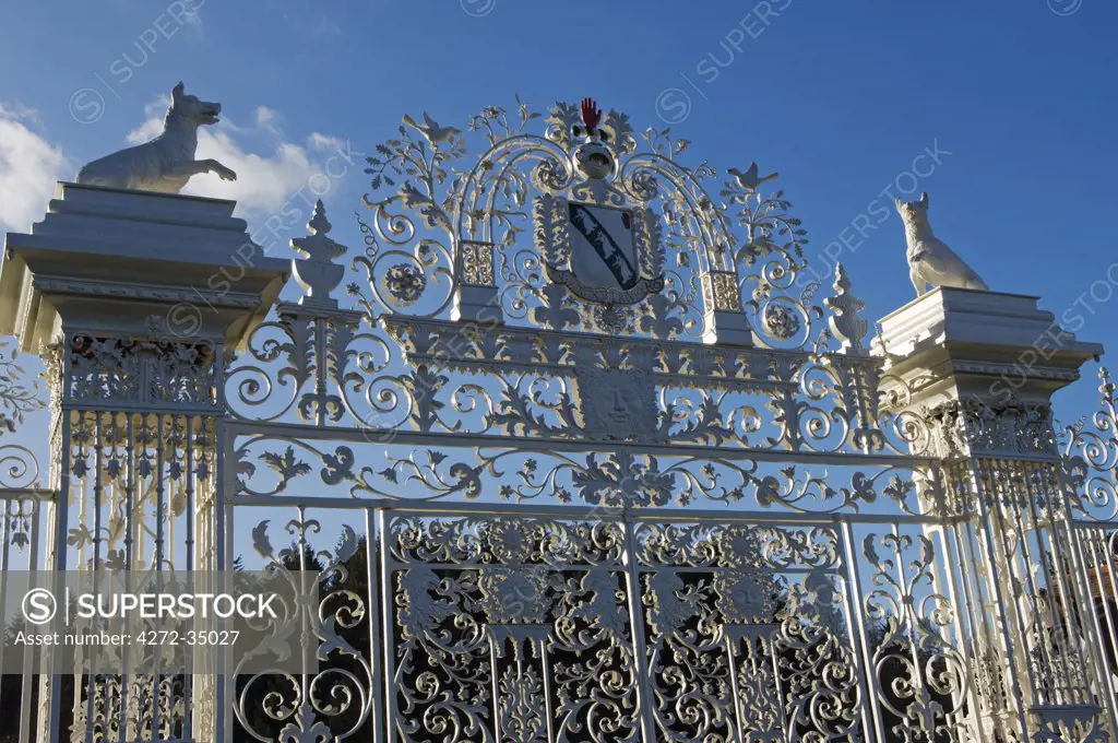 Wales, Wrexham, Chirk. The Baroque gates of Chirk Castle, wrought by the Davies brothers of Bersham around 1712 AD, are topped by the Myddelton coat of arms and a pair of wolves.