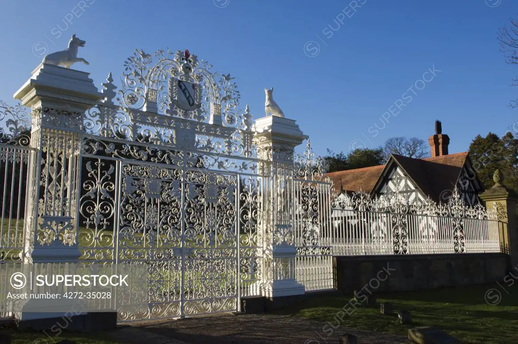Wales, Wrexham, Chirk. The Baroque gates of Chirk Castle, wrought by the Davies brothers of Bersham around 1712 AD, are topped by the Myddelton coat of arms and a pair of wolves.