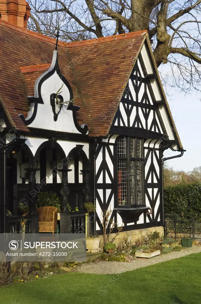 Wales, Wrexham, Chirk. The ornate half-timbered gatekeeper's lodge at the entrance to Chirk Castle.