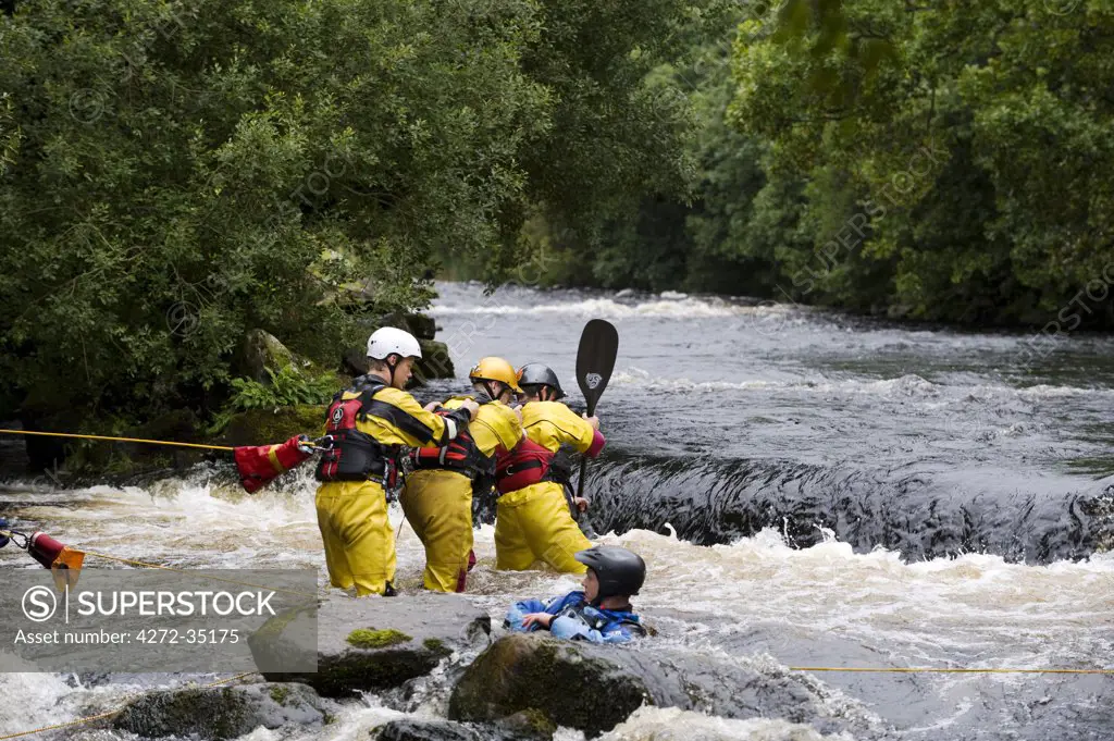 Wales, Gwynedd, Bala. An exercise to simulate rescuing a capsized canoeist at the National Whitewater Centre