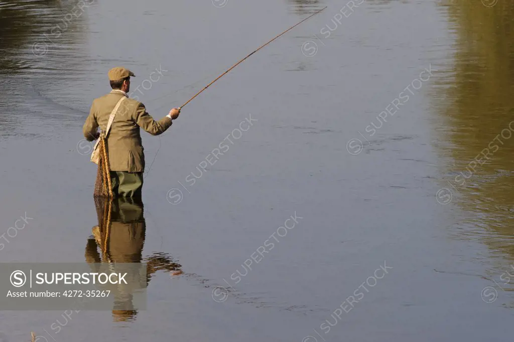 Wales; Wrexham. A trout fisherman casting on the River Dee (MR)