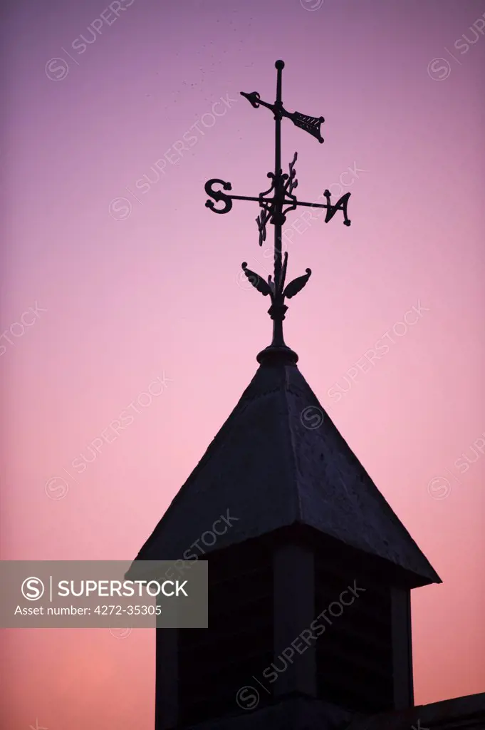 UK, Wales. Weathervane on a stable building