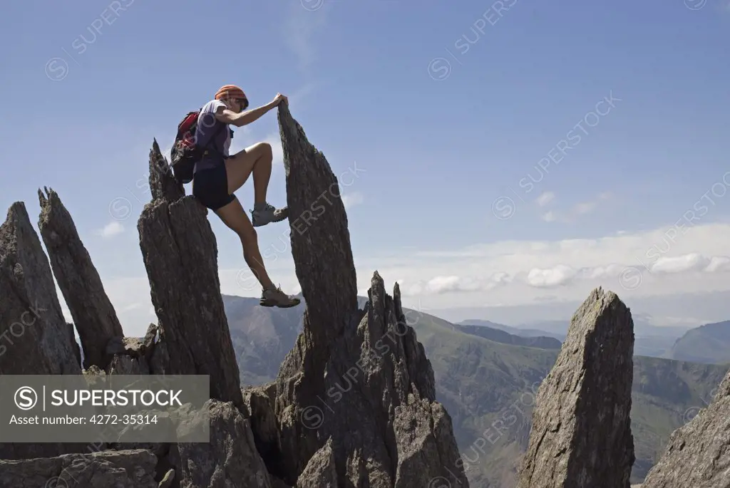 North Wales, Snowdonia. Active woman walking and climbing in the Ogwen Valley, Snowdonia, North Wales (MR)