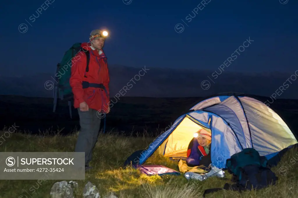 Gilar Farm, Snowdonia, North Wales.  Man and woman camping . (MR)