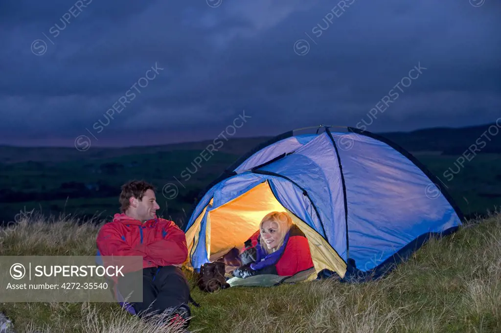 Gilar Farm, Snowdonia, North Wales.  Man and woman camping in the wild. (MR)