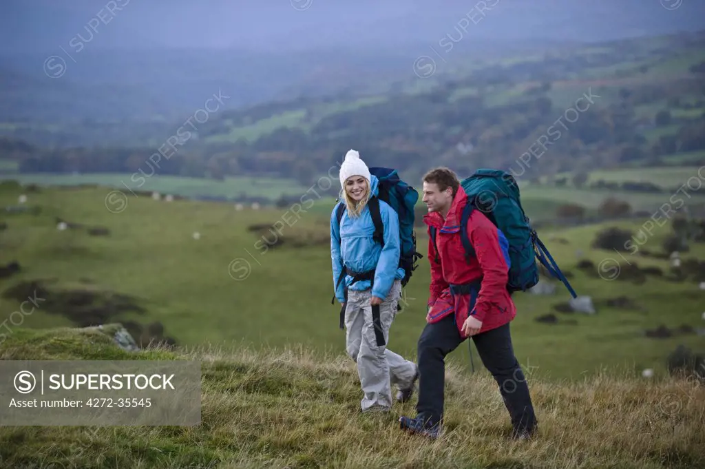 Gilar Farm, Snowdonia, North Wales.  Man and woman trekking in the wild. (MR)