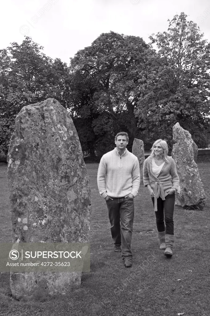 UK, North Wales, Llanwrst.  A couple visit the stone circle. (MR)