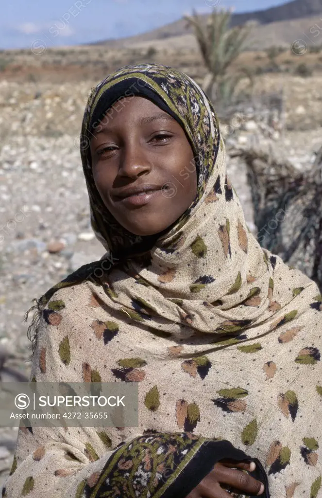An attractively dressed Muslim girl in the foothills of the Homhill Mountains