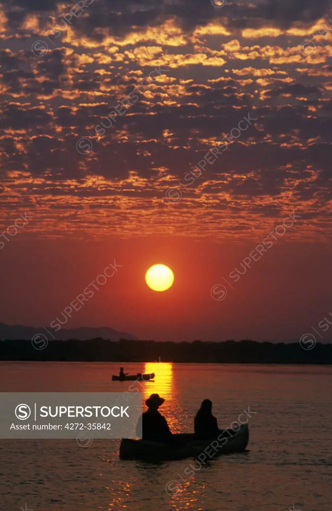 Canoeing at sun rise on the Zambezi River.