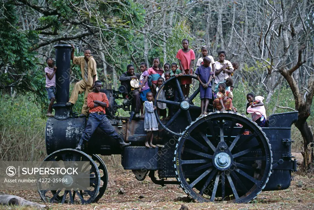 Children of estate workers pose for picture on the old traction engine at Shiwa.