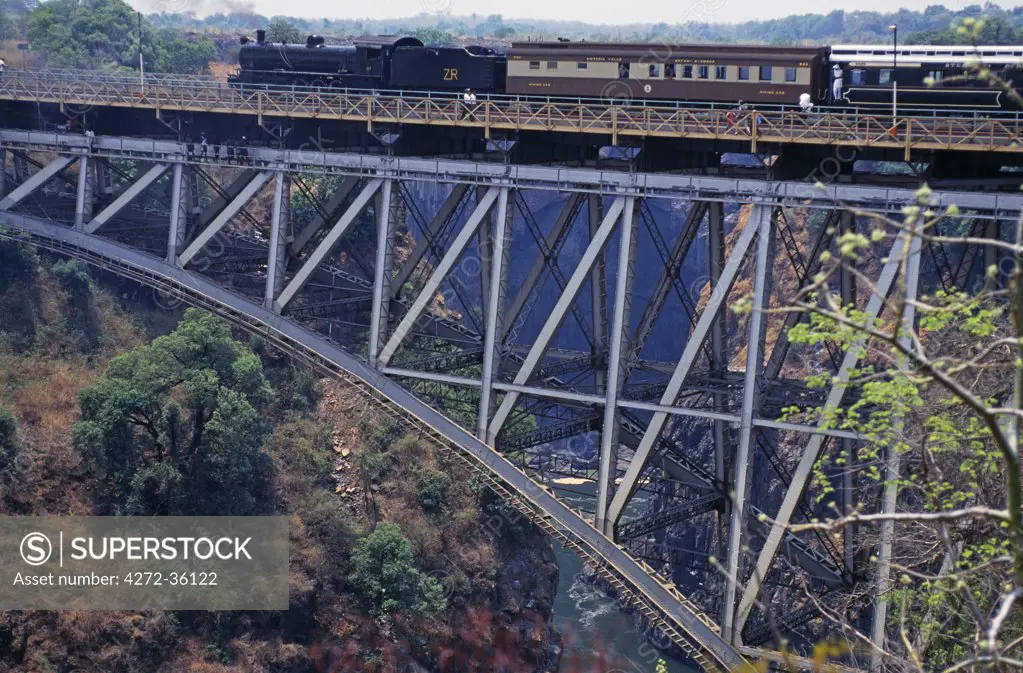 Steam train going over Victoria Falls Suspension Bridge, Victoria Falls, Zimbabwe. National Railway Zimbabwe.