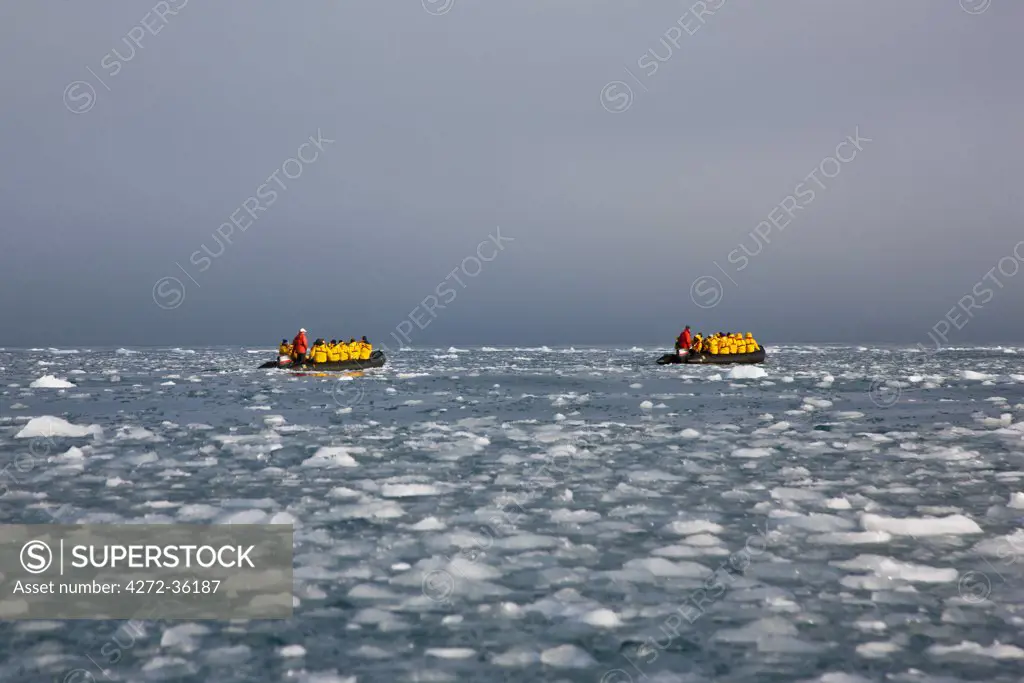 Visitors in Zodiac inflatable boats pass through a sea of brash ice on their way to visit Point Wild off Elephant Island at the northeast end of the South Shetland Islands.