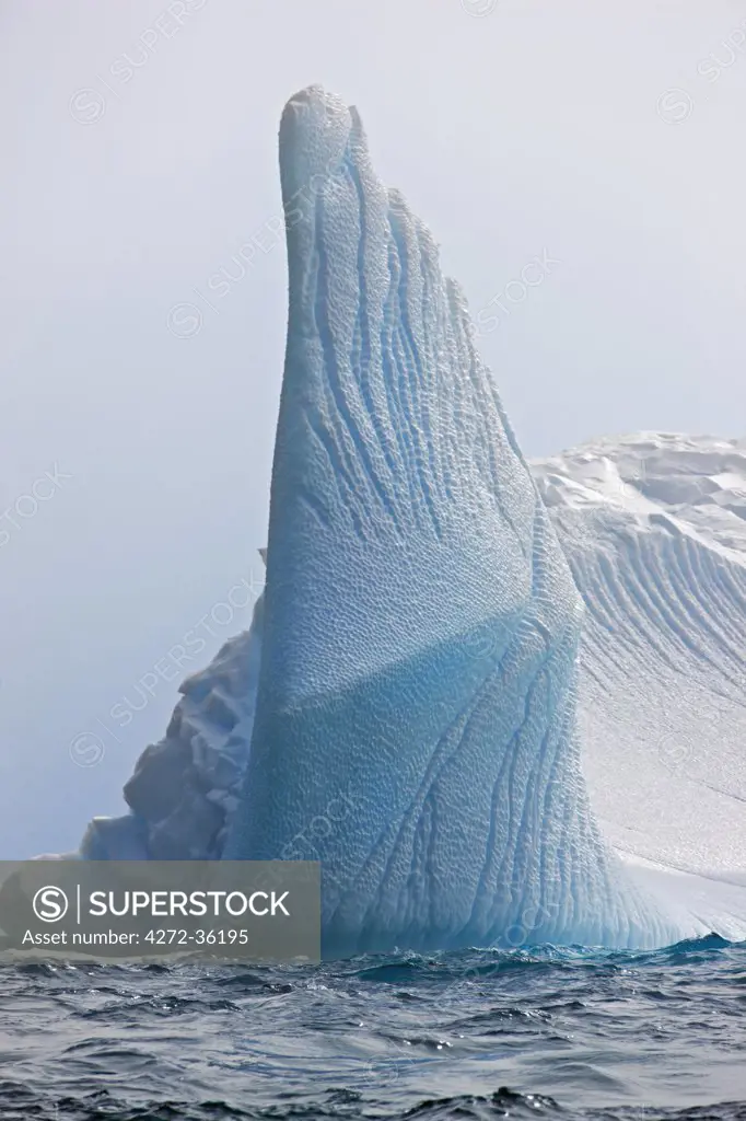 A sculptured iceberg off Gibbs Island, which lies to the southwest of Elephant Island and is part of Britains South Shetland Islands.