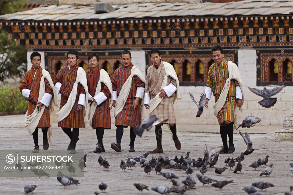Young men attending the masked dancing at Trashi Chhoe Dzong, a monastery now also housing the secretariat, the throne room and offices of the King.