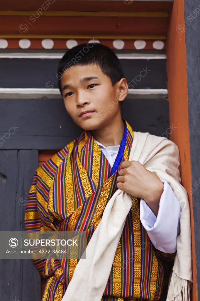 Young boy watching the masked dancing at Trashi Chhoe Dzong, a monastery now also housing the secretariat, the throne room and offices of the King.