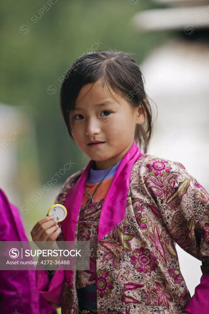 Young girl at the National Memorial Chorten, which was built in the Tibetan style in 1974 to honour the third king.