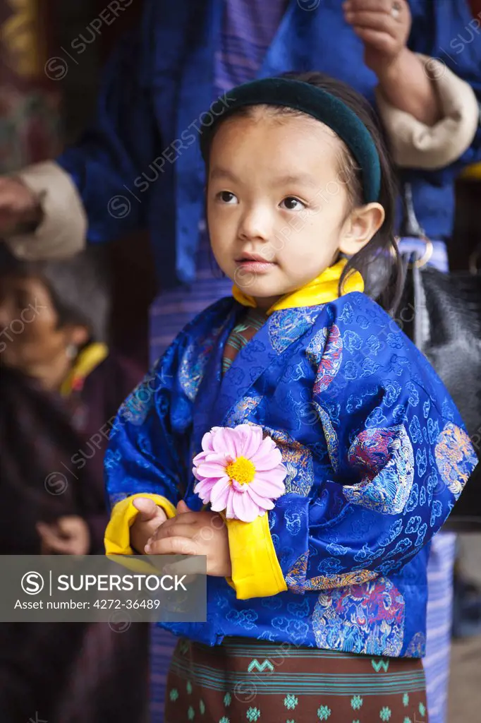 Young girl at the National Memorial Chorten, which was built in the Tibetan style in 1974 to honour the third king of Bhutan.