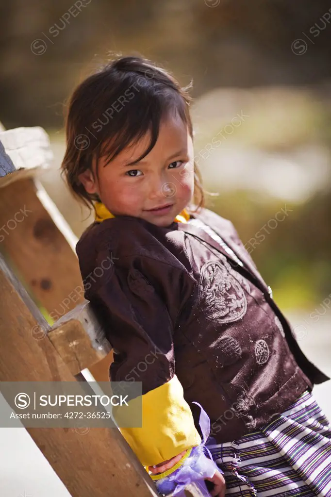 Young girl in traditional Bhutanese dress in Phobjika Valley.