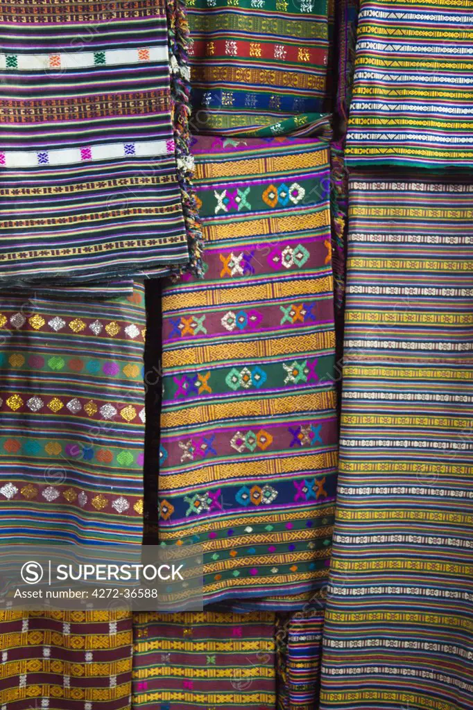 Colourful fabrics for ladies' kiras for sale in a shop in Jakar, Bumthang Valley.