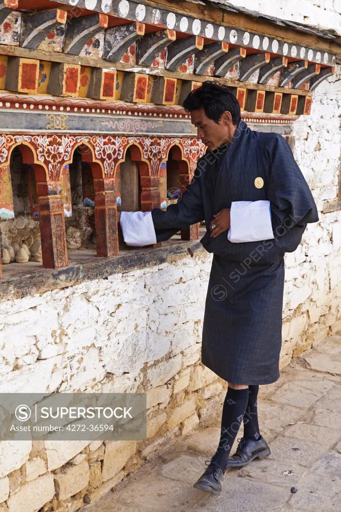 Turning the prayer wheels at Ura Lhakhang.