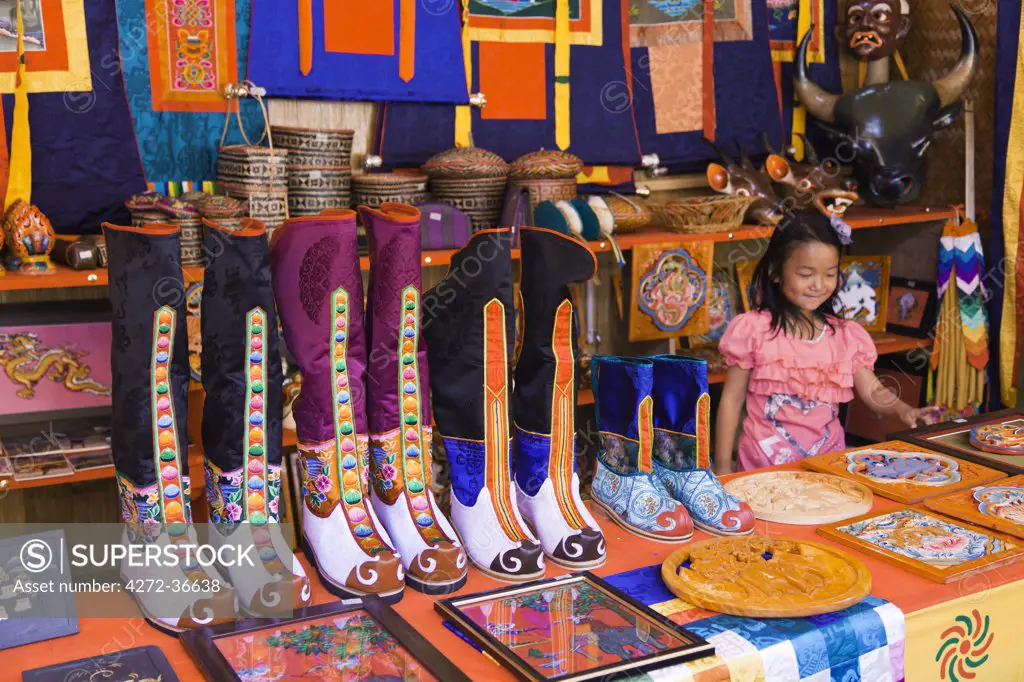Traditional knee-length boots known as Tsholham, worn by Bhutanese men during important ceremonial occasions, for sale in a shop in Thimphu.