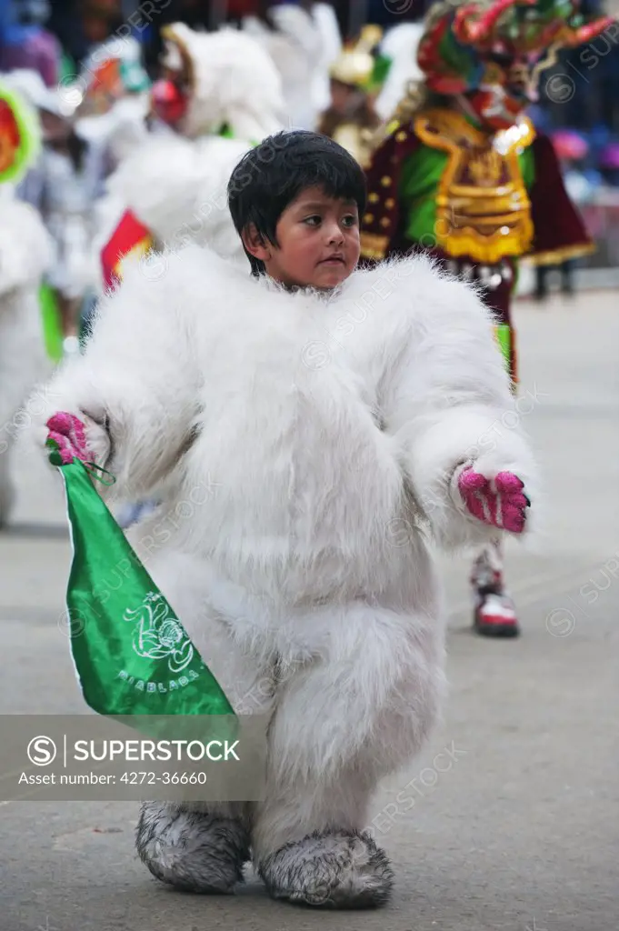South America, Bolivia, Oruro, Oruro Carnival; boy in costume
