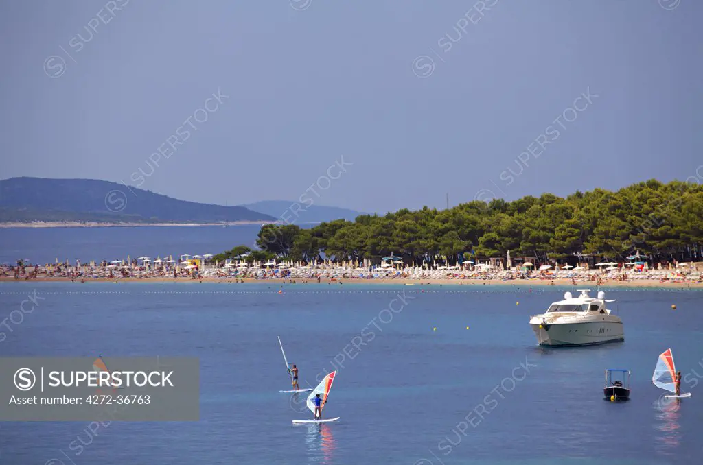 Croatia, Brac Island, Central Europe. Yacht and surfers at the beach in Bol