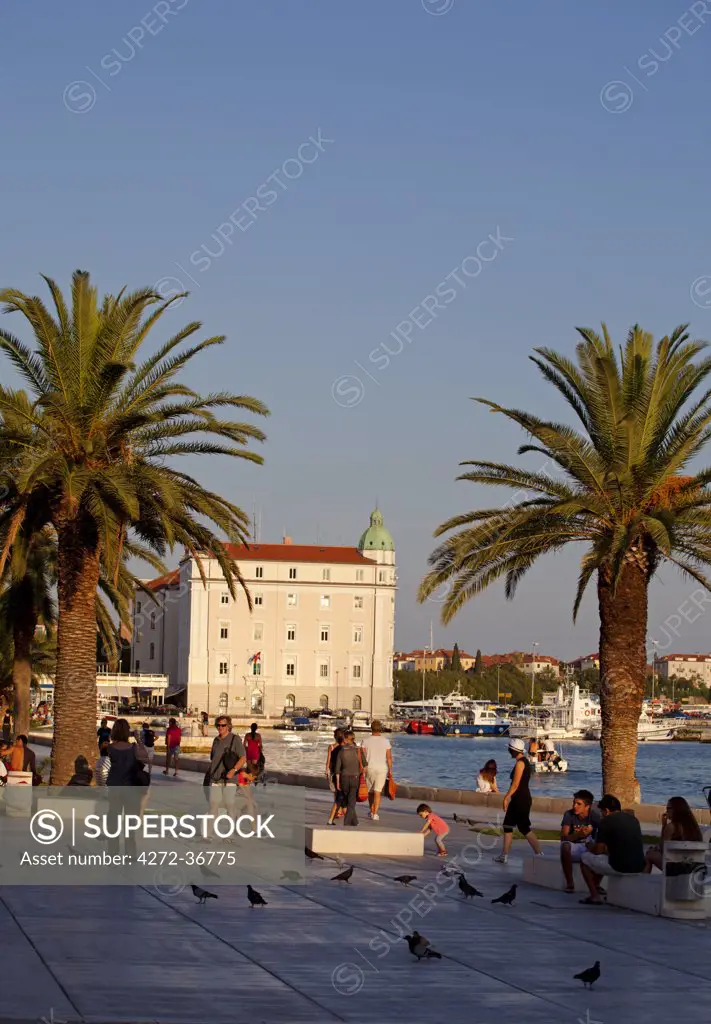 Croatia, Split, Central Europe. People walking on the bank of the harbour area in historical centre