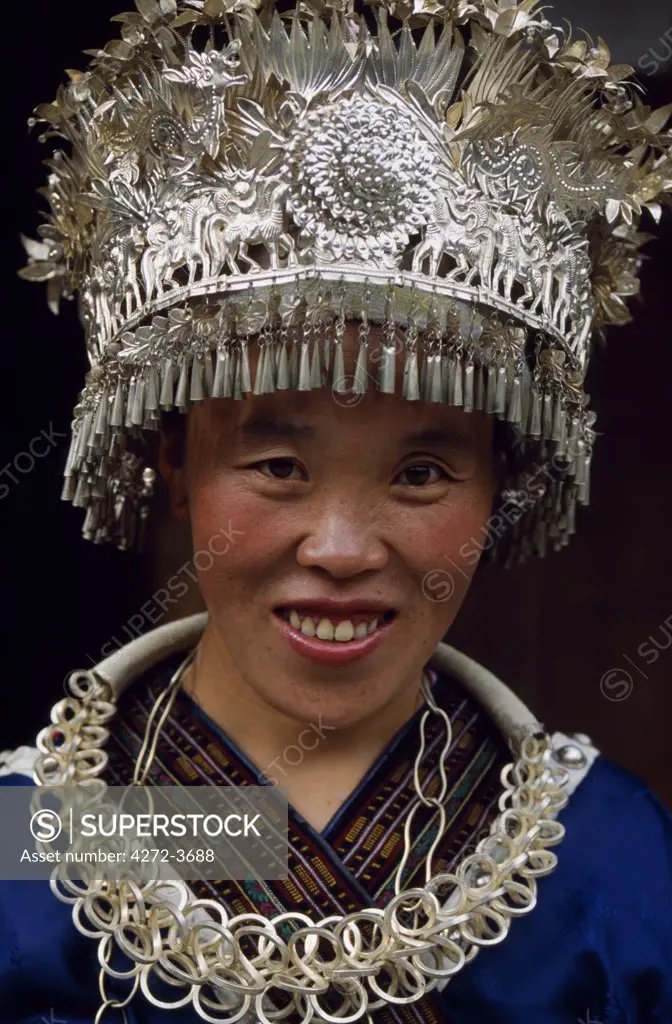 A Miao woman wears her festive finery at Langde Village