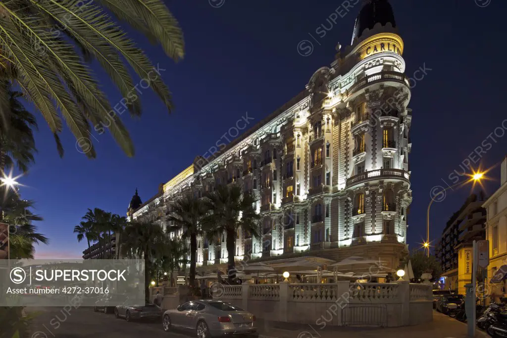 Cannes, Provence-Alpes-Cote d'Azur, France. View of the InterContinental Carlton Hotel from the La Croisette premenade by night