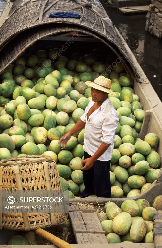 Loading water melons onto a barge on one of the canals in Shaoxing.  The city is known for its canals and its rice wine.