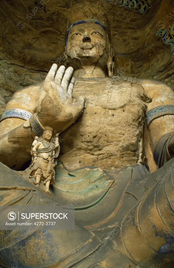 The 5th Century Yungang Caves are among China's most celebrated grottoes.  In Cave 13, the 15 metre high Buddha's arm is supported by a smaller four-armed Buddha.