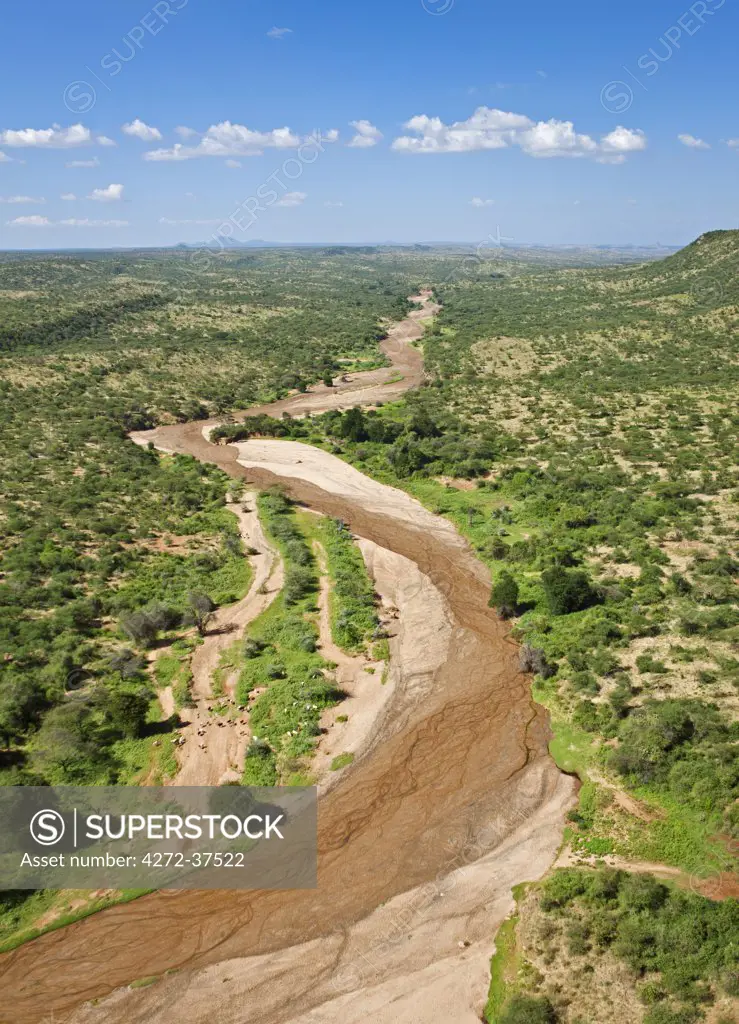 The seasonal Seiya River courses its way through semi-arid scrub country in the low-lying parts of Samburu District