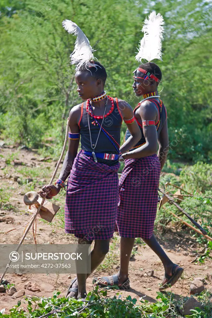 Pokot warriors watch a Sapana ceremony an important rite of passage for a youth to become a warrior