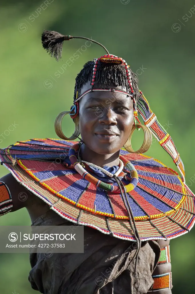 A Pokot woman in traditional dress. Her leather skirt is made from tanned goatskins.